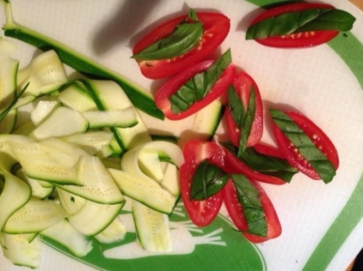 ribboned courgette and basil tomatoes, ready to be added to the roasting carrots.....